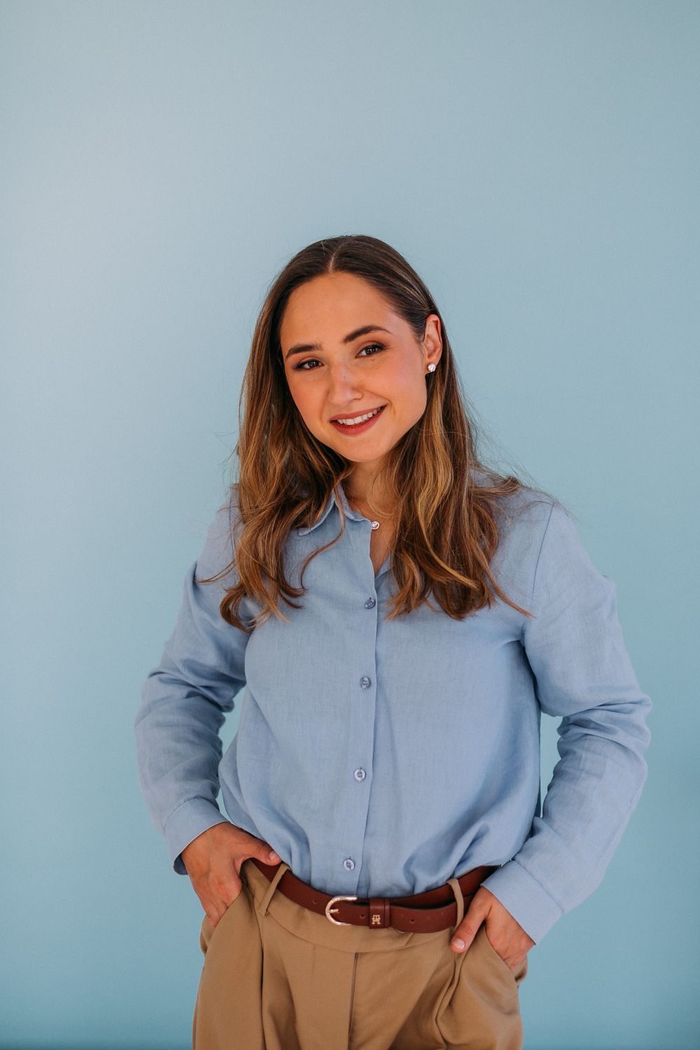 Viktorija Garanca in a light blue shirt, relaxed, smiling