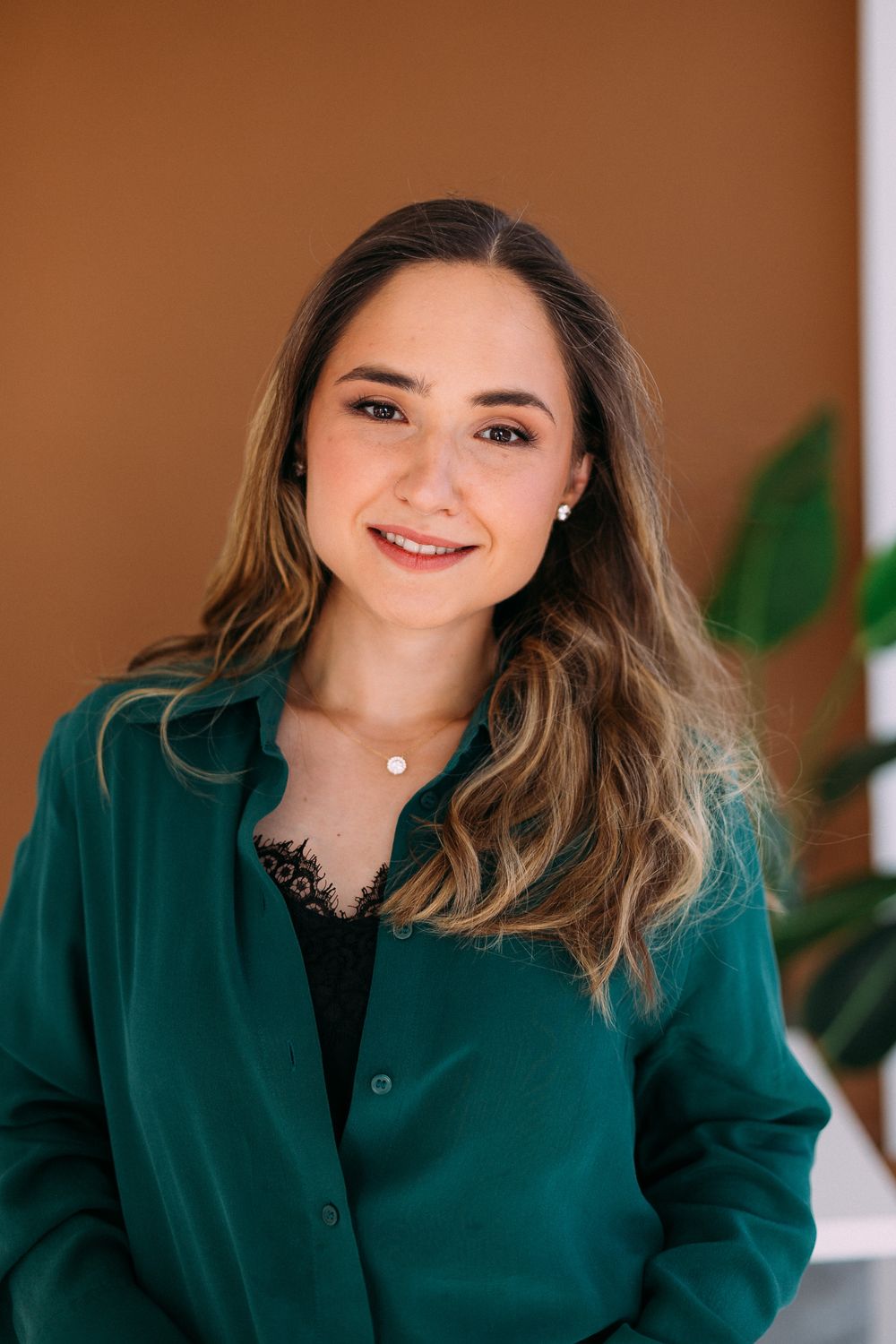 Viktorija Garanca in a green blouse, smiling